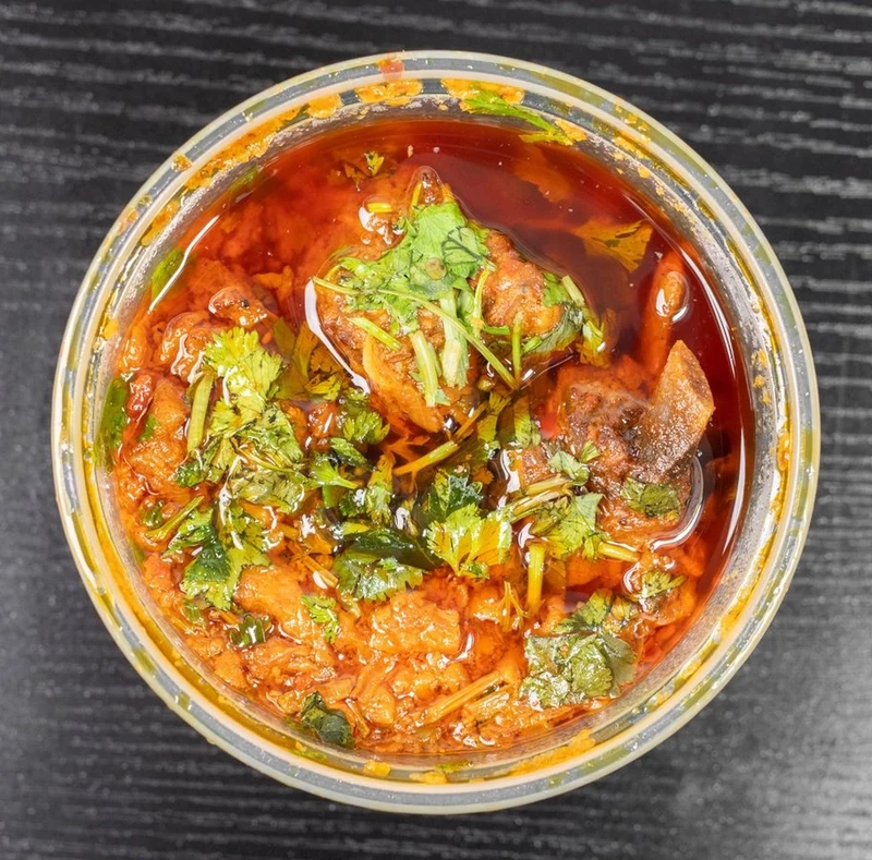 Chicken karahi in a rich aromatic sauce at Afghan Chatkhara Restaurant, Castleridge Calgary