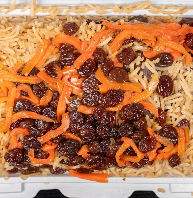 Kabuli pulao with tender lamb shank, carrots and raisins at Afghan Chatkhara Restaurant, Calgary NE