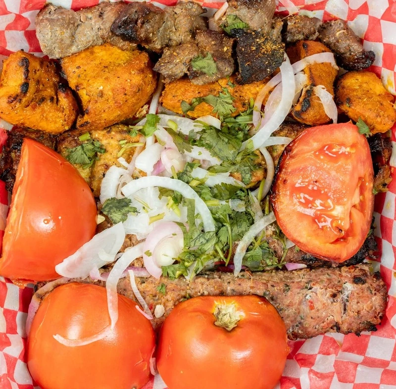 Mixed kebab platter with Afghani tikka, ground beef and chicken skewers at Afghan Chatkhara Restaurant, Calgary