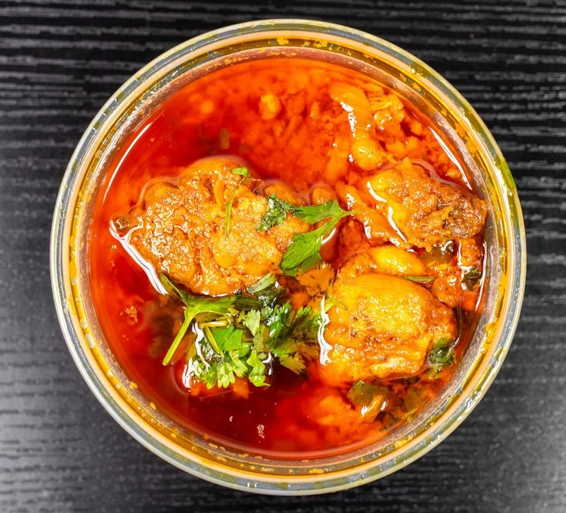 Mutton karahi cooked with bold aromatic spices at Afghan Chatkhara Restaurant, Calgary NE