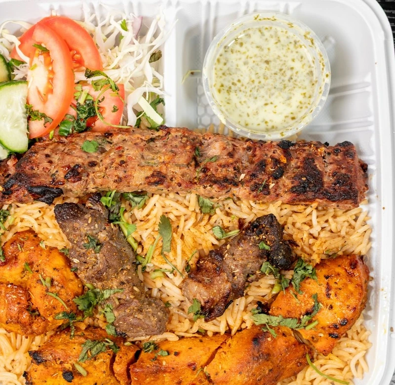 Combo platter with chicken tikka, ground beef and Afghani tikka skewers at Afghan Chatkhara Restaurant, Calgary