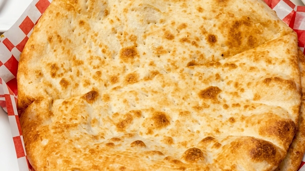 Fresh tandoor-baked plain naan at Afghan Chatkhara Restaurant, Castleridge, Calgary NE